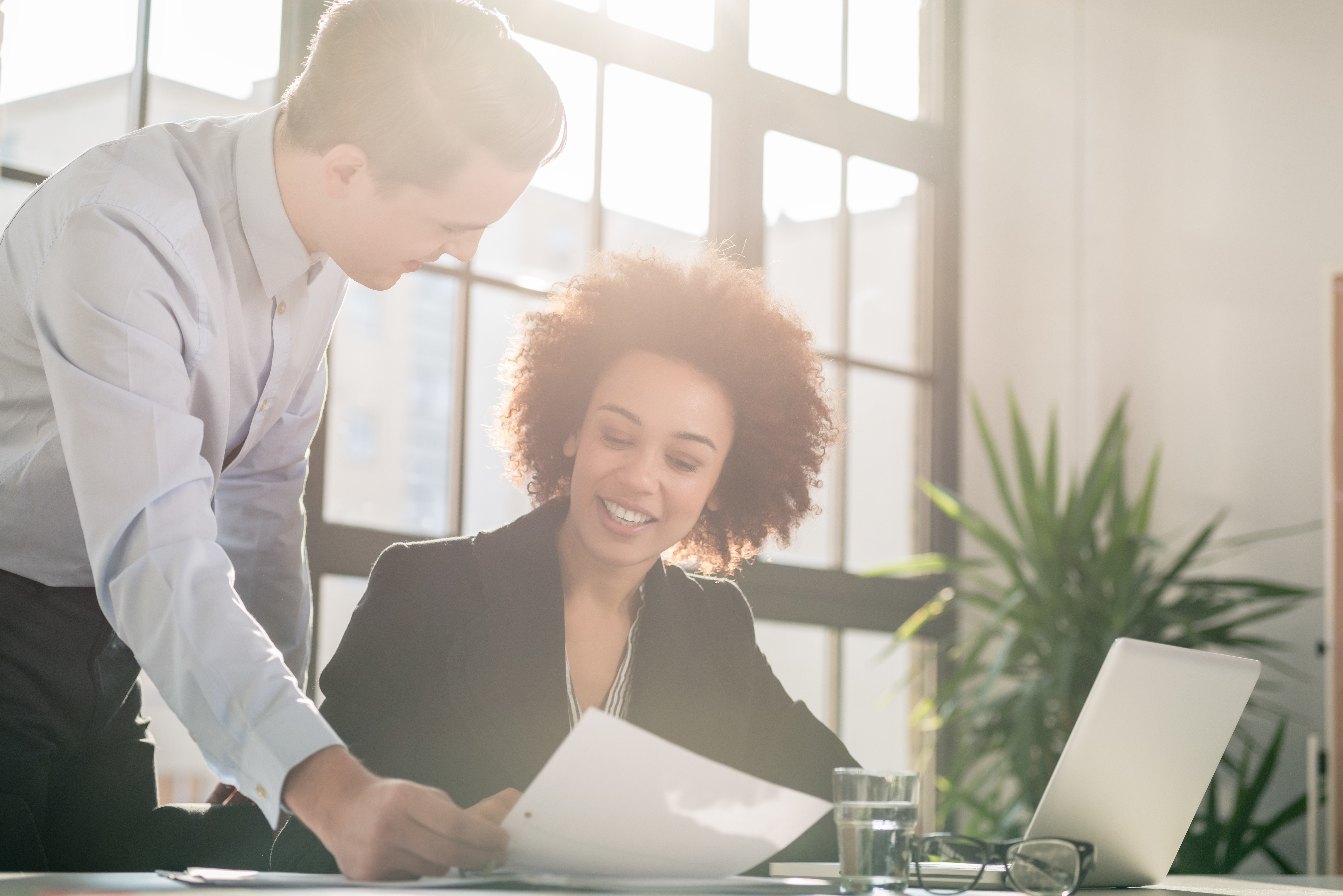 Business man showing to his colleague a document